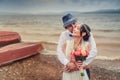 Boho wedding. beautiful couple kissing on the coast