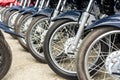 Bohol, Philippines - Rows of Kawasaki Bajaj 125 motorcycles for sale at a dealership. Motorbikes at an outdoor lot. Low