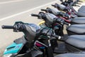 Bohol, Philippines - Rows of Yamaha Mio i125 motorcycles for sale at a dealership. Motorbikes at an outdoor lot