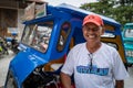 Bohol, Philippines - September 11 2019: A tricycle driver smiling at the camera.