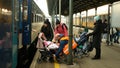 BOHUMIN, CZECH REPUBLIC, MARCH 17, 2022: Refugees Ukraine children family Adra volunteer helps loading baby carriage