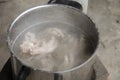 Boil chicken bone, foot and pork bone for cooking soup stock Royalty Free Stock Photo