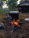 boil water with firewood behind the house Royalty Free Stock Photo