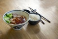 Boild pork surve with rice and soup in bowl