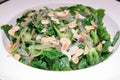 Boile spinach with butter in white plate