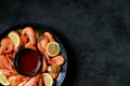 Cooked large shrimps with lemon, dill and tomato sauce. Healthy food. Top view. Royalty Free Stock Photo