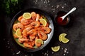 Cooked large shrimps with lemon, dill and tomato sauce. Healthy food. Top view. Royalty Free Stock Photo