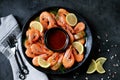Cooked large shrimps with lemon, dill and tomato sauce. Healthy food. Top view. Royalty Free Stock Photo