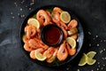 Cooked large shrimps with lemon, dill and tomato sauce. Healthy food. Top view. Royalty Free Stock Photo