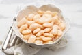 boiled big white beans with sauce on white bowl Royalty Free Stock Photo