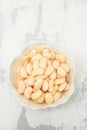 boiled big white beans with sauce on white bowl Royalty Free Stock Photo
