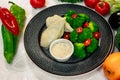 Boiled chicken breast with broccoli and tomatoes with sauce, healthy food in a white plate on a white table Royalty Free Stock Photo