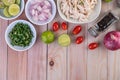 Boiled chicken cut into pieces in a white dish on a wooden table Royalty Free Stock Photo