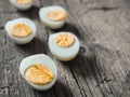 Boiled chicken eggs on wooden background. The concept of Easter