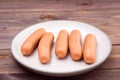 Boiled chicken sausages ready to eat on a plate Royalty Free Stock Photo