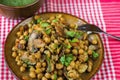 Boiled chickpea with roasted champignon, carrot, zucchini, onion and parsley leaf.