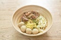 Boiled Chinese yellow egg noodles with braised beef and meatball in soup on bowl Royalty Free Stock Photo