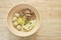 Boiled Chinese yellow egg noodles with braised beef and meatball in soup on bowl Royalty Free Stock Photo