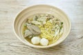 Boiled Chinese yellow egg noodles with entrails and fish ball in soup on bowl Royalty Free Stock Photo