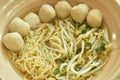 Boiled Chinese yellow egg noodles with pork meatball and bean sprout in soup on bowl Royalty Free Stock Photo