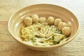 Boiled Chinese yellow egg noodles with pork meatball and bean sprout in soup on bowl Royalty Free Stock Photo