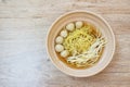 Boiled Chinese yellow egg noodles with pork meatball and bean sprout in soup on bowl Royalty Free Stock Photo