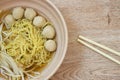 Boiled Chinese yellow egg noodles with pork meatball and bean sprout in soup on bowl Royalty Free Stock Photo