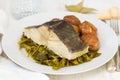 Boiled cod fish with potato and greens Royalty Free Stock Photo