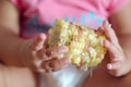 Boiled corn in the babies hands