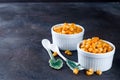 Boiled corn kernels in white cups Royalty Free Stock Photo