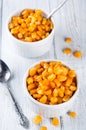 Boiled corn kernels in white cups Royalty Free Stock Photo