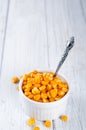 Boiled corn kernels in white cups Royalty Free Stock Photo