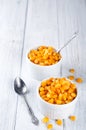 Boiled corn kernels in white cups Royalty Free Stock Photo