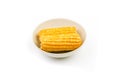 Boiled corn on a plate on a white background. Isolate. Close-up Royalty Free Stock Photo