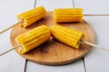 Boiled corn on a white wooden natural background