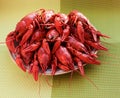 Boiled crawfish on a plate on a green background Royalty Free Stock Photo