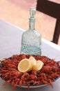 Boiled crayfish. Arranged on a large platter. Garnished with lemon slices. Close-up. Royalty Free Stock Photo