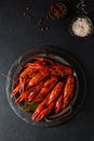 boiled crayfish on a black plate Royalty Free Stock Photo