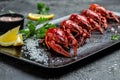 Boiled crayfish or crawfish with lemon and salt ready to eat on black plate. Restaurant menu, dieting, cookbook recipe Royalty Free Stock Photo