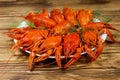 Boiled crayfish in plate on wooden table Royalty Free Stock Photo