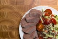 boiled cutting raw tongue with salad on white plate