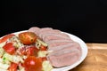 boiled cutting raw tongue with salad on white plate