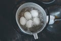 Boiled duck eggs in a pot of boiling water