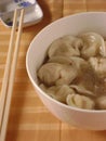 Boiled dumplings with meat filling in soup Royalty Free Stock Photo