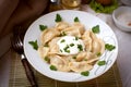 Boiled dumplings with sourcream Royalty Free Stock Photo