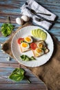 Boiled egg with bacon and vegetables in a plate Royalty Free Stock Photo