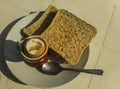 Boiled egg with brown toast and spoon on a white plate Royalty Free Stock Photo