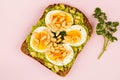 Boiled Egg on Crushed Avocado With Pine Nuts And Rye Bread Open