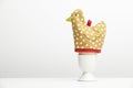 Boiled egg in cup with hen egg warmer Royalty Free Stock Photo