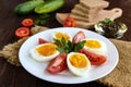 Boiled egg and fresh tomato, black bread - light diet breakfast Royalty Free Stock Photo